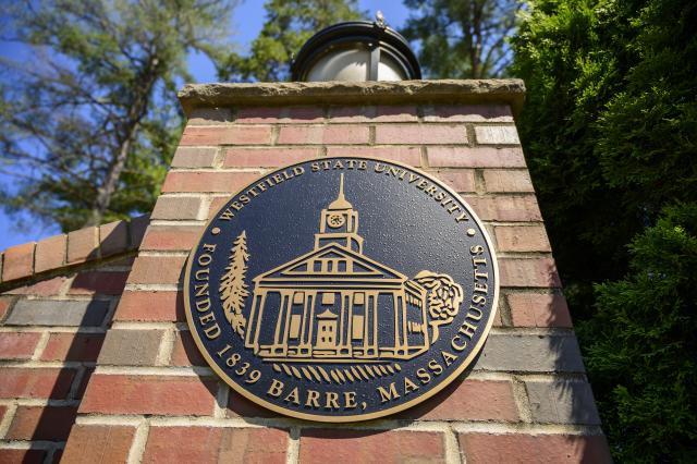 University seal on the main gate to campus