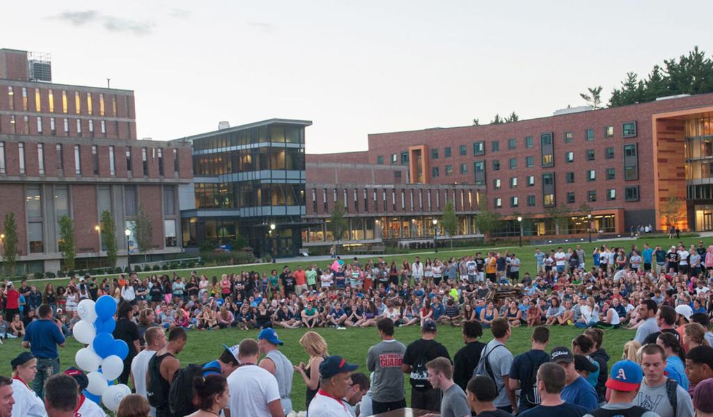 Pep rally on the campus green with Ely Campus Center in the background